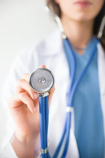 Photo of doctor holding a stethoscope